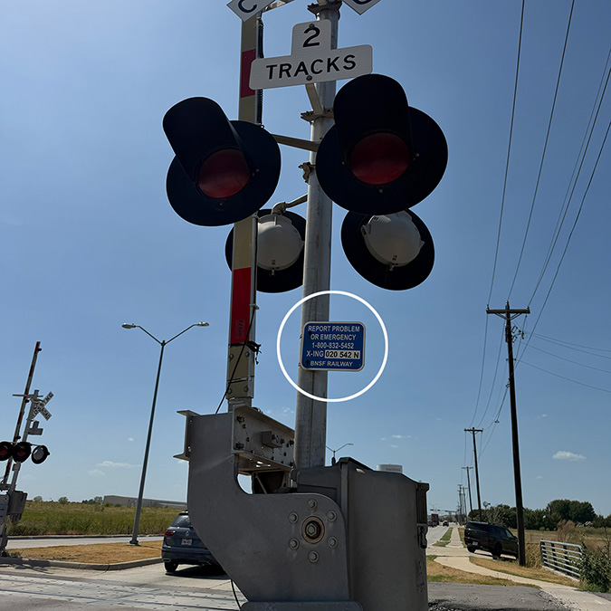 Location of the ENS sign on a grade crossing signal. Location of the ENS sign on a grade crossing signal.